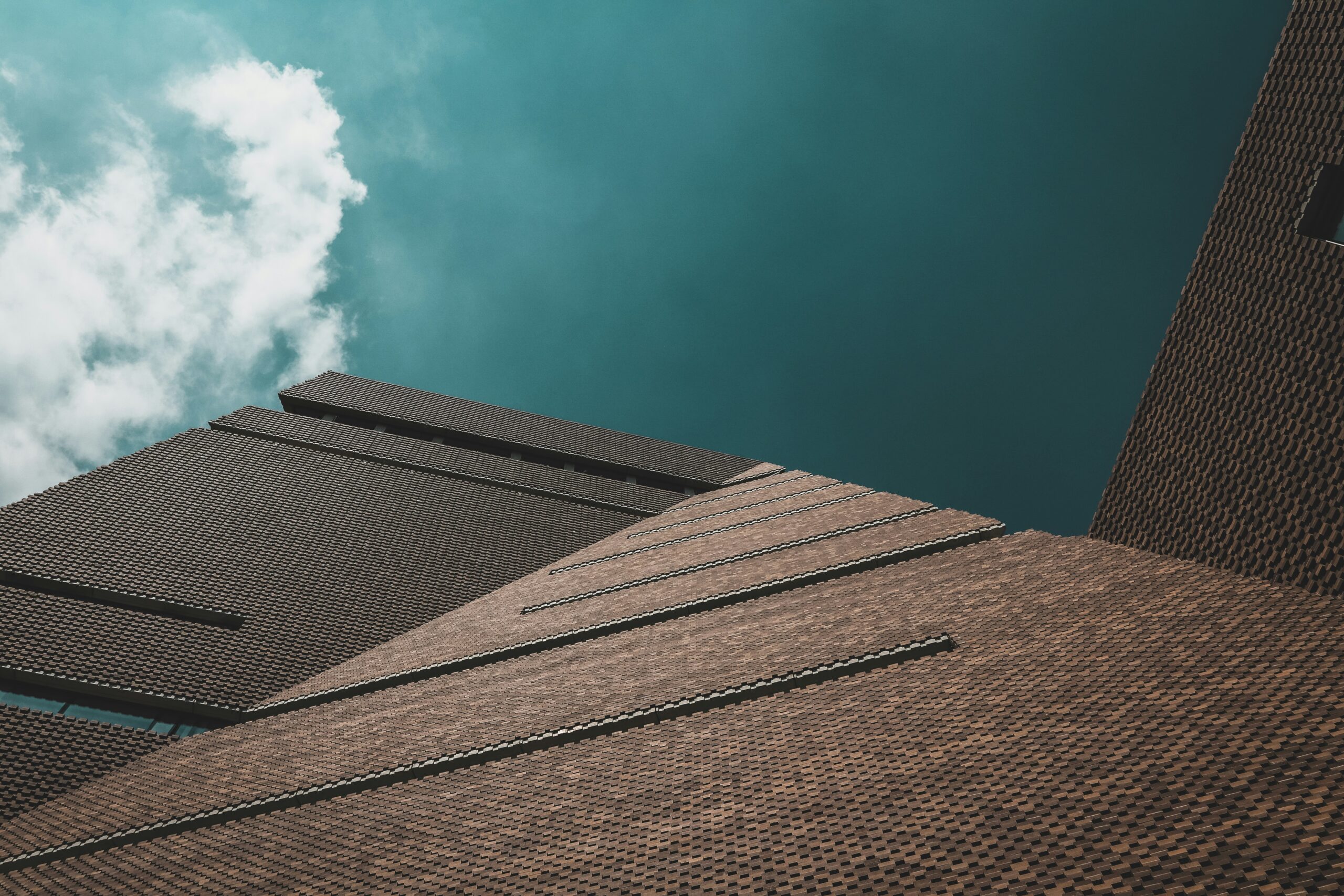 worms eye view of brown concrete building during day time